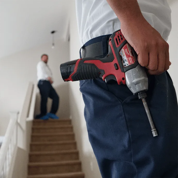 HVAC technician providing free AC consultation to homeowner