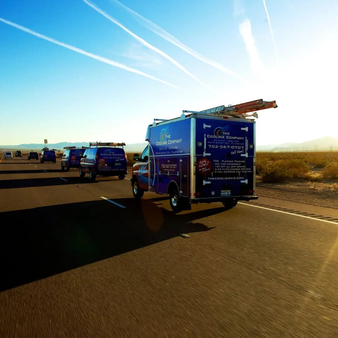 HVAC technician inspecting a gas furnace heat exchanger during annual maintenance